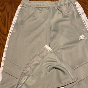 Ladies Adidas track pants, gently worn. Gray, unlined. Zipper ankles, drawstring